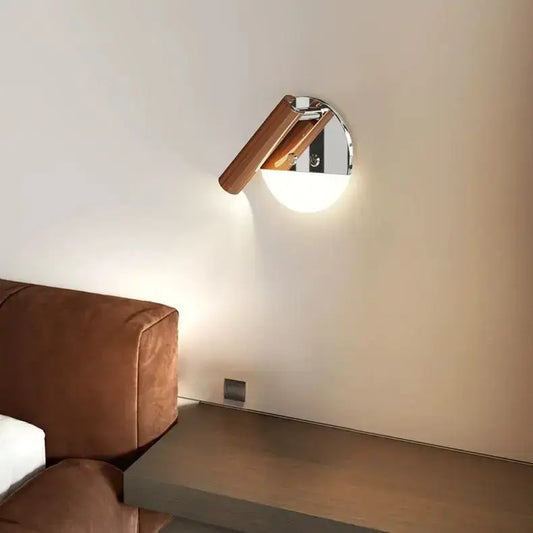 Modern chrome and wood wall lamp with spectrum eye protection featuring a warm wooden arm and soft ambient light