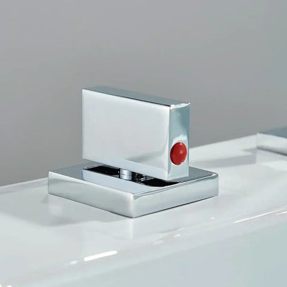 Modern chrome arched dual handle basin faucet featuring a chrome-finished rectangular glass door handle with red button