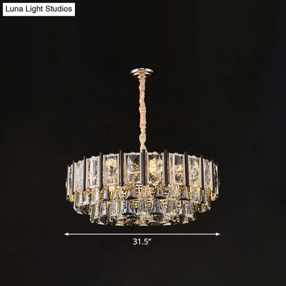 A modern crystal chandelier by decorbites with gold frame and clear crystals featuring adjustable chain cord length
