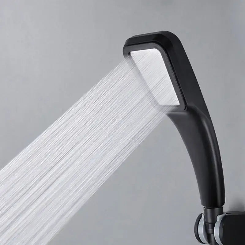 Black handheld shower head with sleek curved design and rectangular spray face for a high pressure shower experience