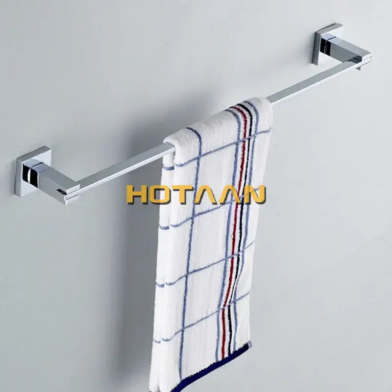 Modern chrome and blue stainless steel wall-mounted towel rack holding white towel with blue and red striped grid pattern bathroom accessories set