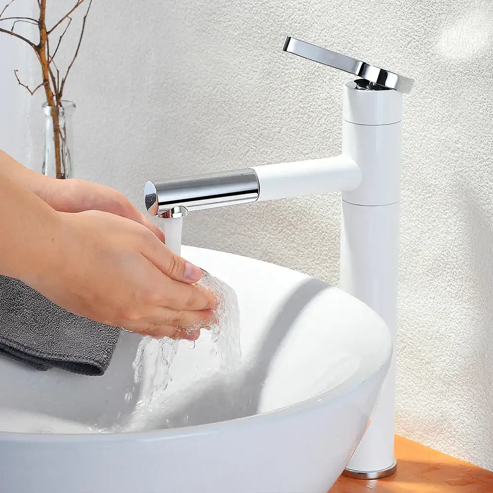 Modern chrome brass bathroom faucet with swivel spout paired with white ceramic basin for bathroom faucet vessel use