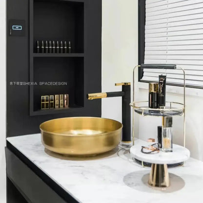 Gold bowl sink with polished metallic finish paired with modern chrome brass bathroom faucet vessel swivel spout tap