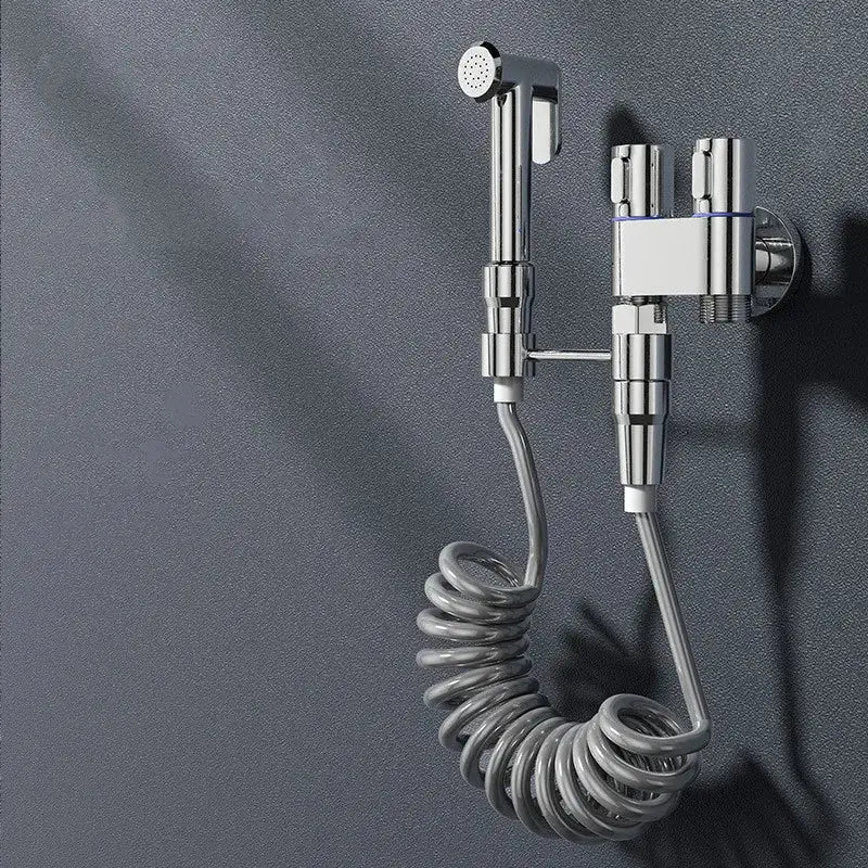 Modern chrome brass bidet set with coiled hose and dual control valves for high pressure handheld spray bathroom use