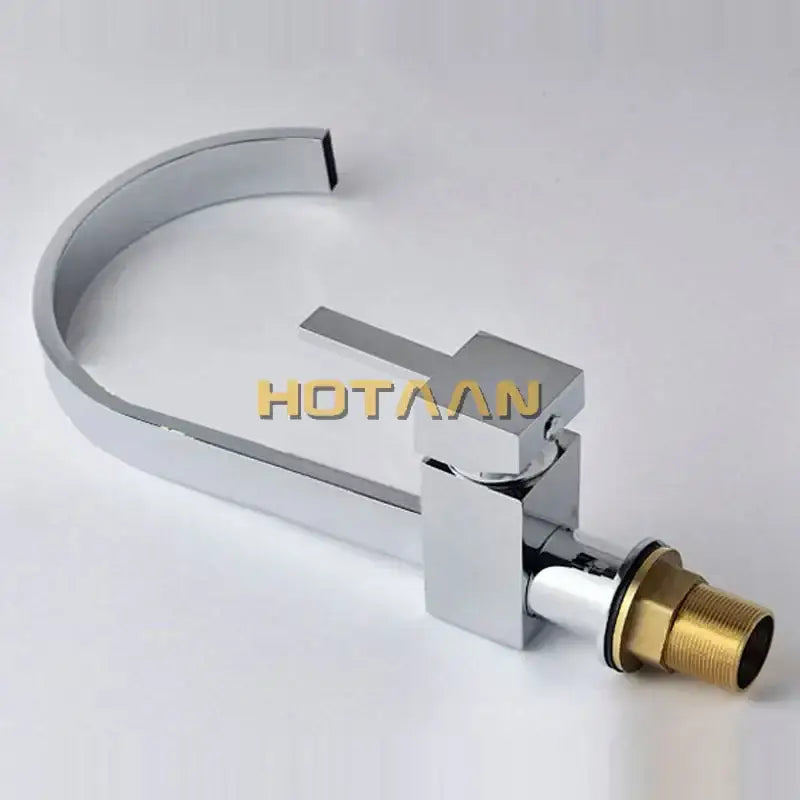 Modern chrome and brass dual hole kitchen tap with sleek angular design and brass-colored threaded connection