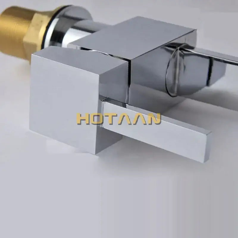 Modern chrome and brass dual hole kitchen tap featuring a square faucet with a brass-colored threaded connection