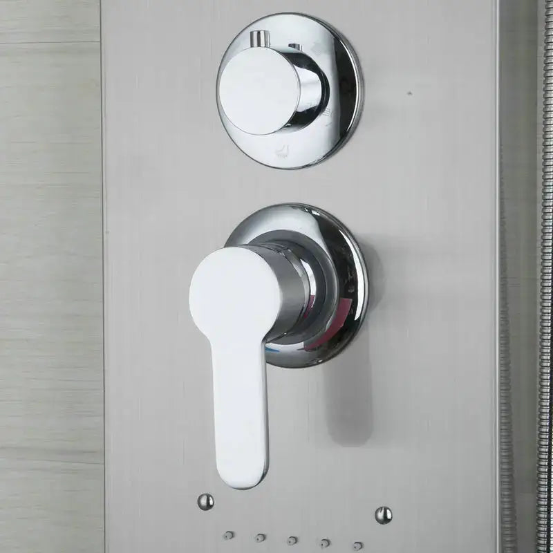 Modern chrome brass shower column with massage jets featuring a chrome shower control panel with white lever handle