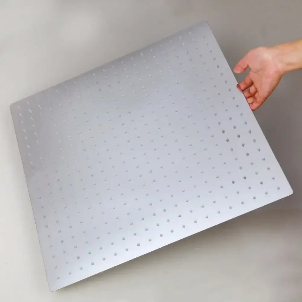 Silver metallic pegboard panel with circular holes for modern chrome brass square rain shower head fixture installation