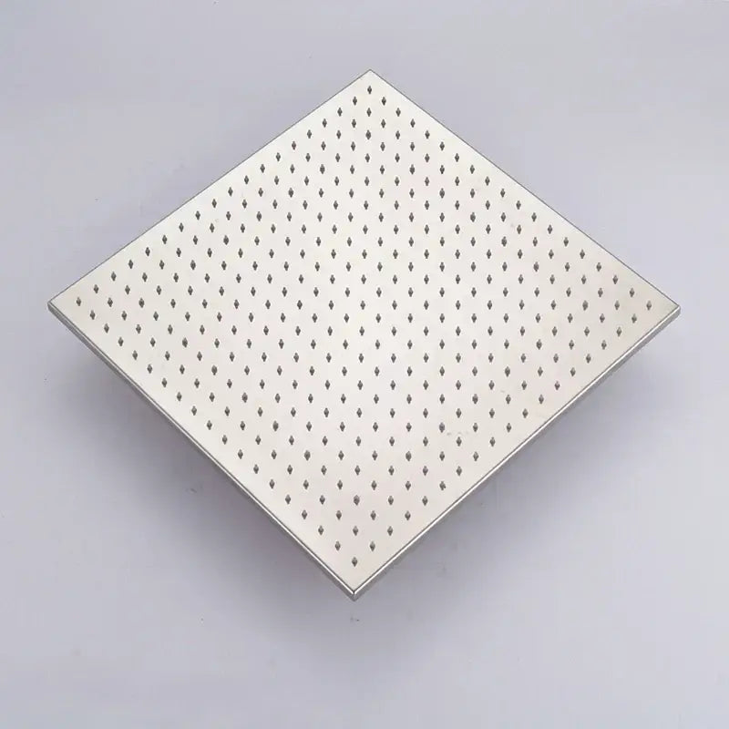 Square stainless steel drain grate with diamond perforations for modern chrome and brushed nickel rainfall shower head bathroom