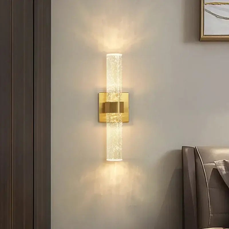 Modern chrome bubble crystal led wall lamp with gold-toned bubble crystal glass cylinder emits warm light for decorbites bubble crystal