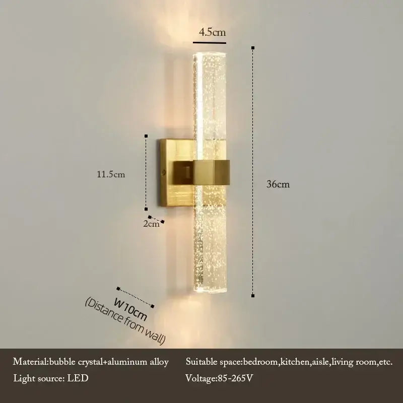 Modern wall lamp with gold-finished aluminum base and decorbites bubble crystal led diffuser emitting warm light
