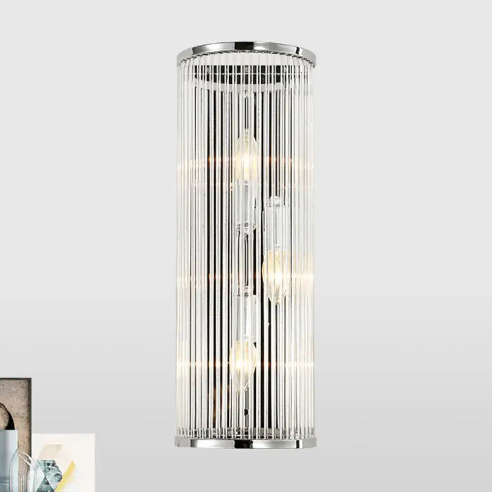Modern chrome clear crystal shade wall light featuring cylindrical design with vertical glass rods and filament bulbs