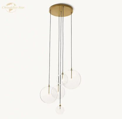 Modern chrome cluster chandelier with brass finish and clear glass globe shades suspended by black cords for living room decorbites clear glass