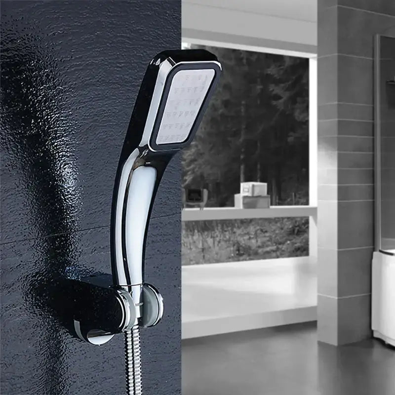 Modern chrome contemporary shower head with sleek curved design and multiple spray nozzles for pressure boost