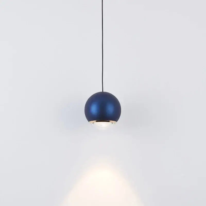 Modern chrome and copper ball pendant light featuring a sleek blue matte finish with gold-toned trim for dining rooms