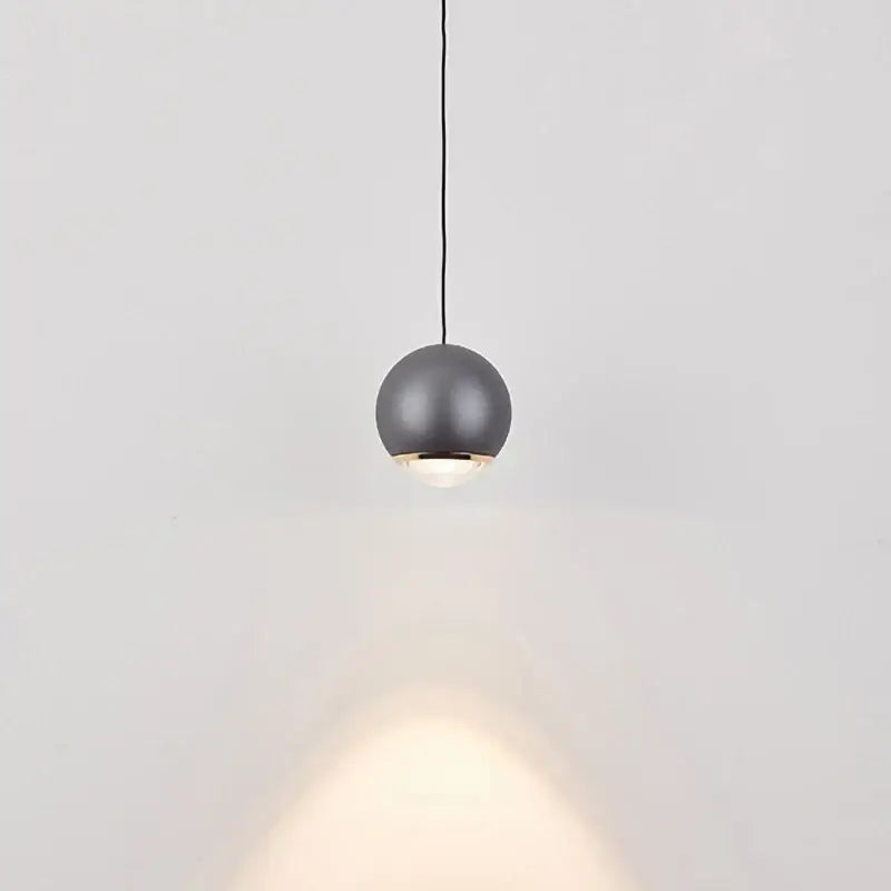 A sleek matte gray ball pendant light modern with warm glow for dining room chrome and copper led chandelier
