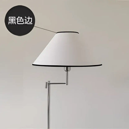 Modern chrome cream rocker arm floor lamp with white conical lampshade and black trim on adjustable chrome stand
