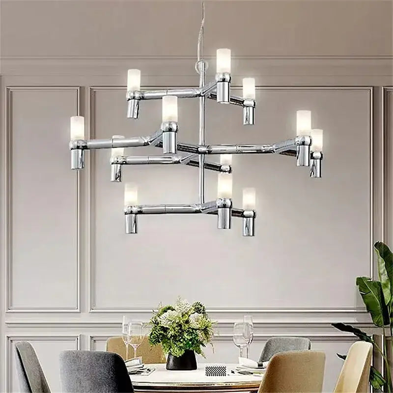 Modern chrome crown major chandelier with cylindrical frosted glass shades in a multi tiered kitchen light design decorbites crown major