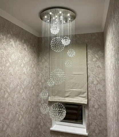 Modern chrome crystal ball chandelier with circular metallic base and clear glass orbs for living room decorbites crystal ball