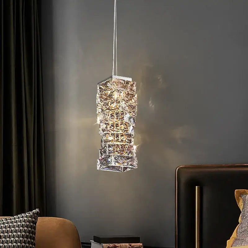 Modern chrome crystal pendant lamp with stacked geometric design and warm golden light for decorbites crystal dining table