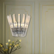 Clear crystal glass wall mount light with modern fan-like design and chrome metallic frame for corridor use