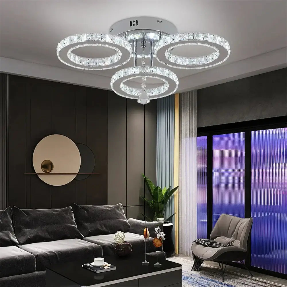 Modern chrome crystal flush mount rings living room light featuring three interlocking crystal rings and central chrome fixture