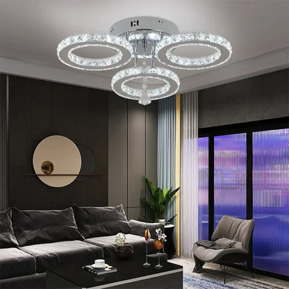 Modern chrome crystal flush mount rings living room light featuring three interlocking crystal rings and central chrome fixture