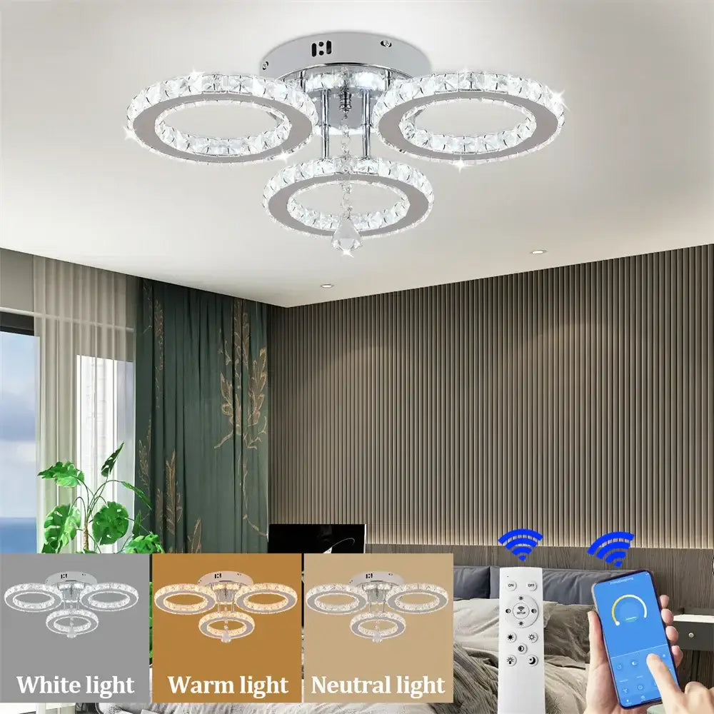 Modern chrome crystal flush mount with three interlocking rings and central crystal drop for living room decorbites decor