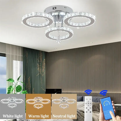 Modern chrome crystal flush mount with three interlocking rings and central crystal drop for living room decorbites decor
