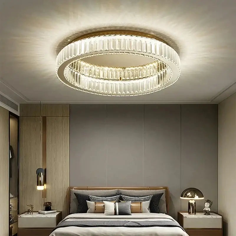 Modern chrome crystal led ceiling light with two concentric rings of faceted crystal and gold-toned metal frame