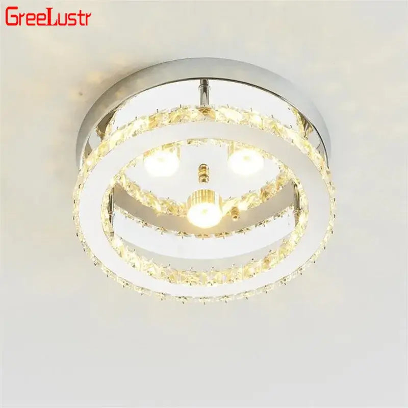 Modern chrome crystal led ceiling light features two concentric rings with clear faceted crystals and warm led bulbs