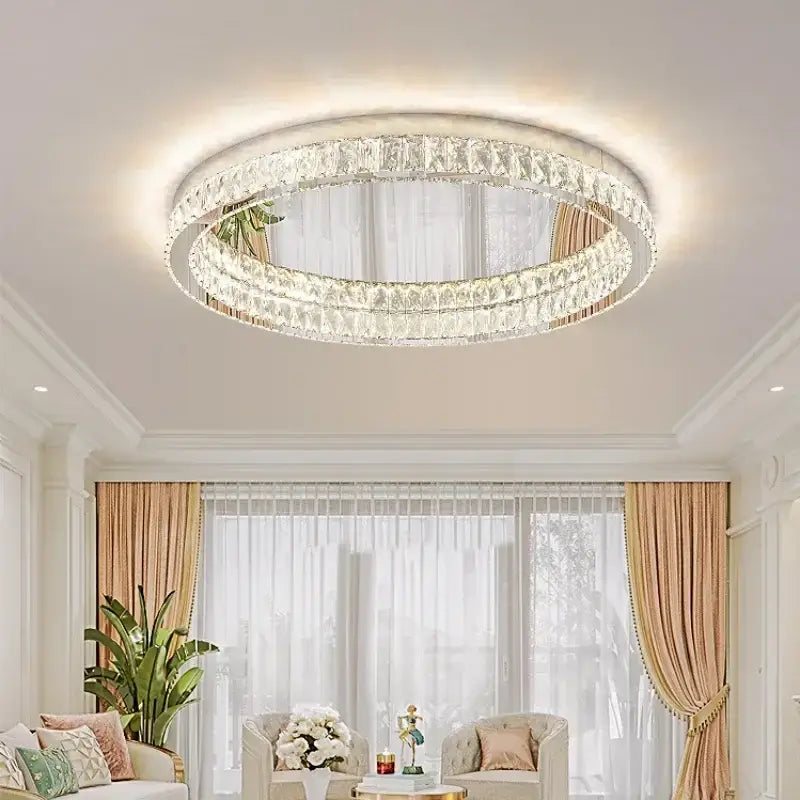 A modern chrome decorbites crystal led ceiling light with two concentric crystal rings in a sleek white frame