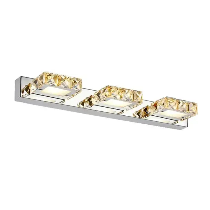 Modern chrome crystal led mirror light bathroom sconce with three rectangular crystal accents emitting warm glow