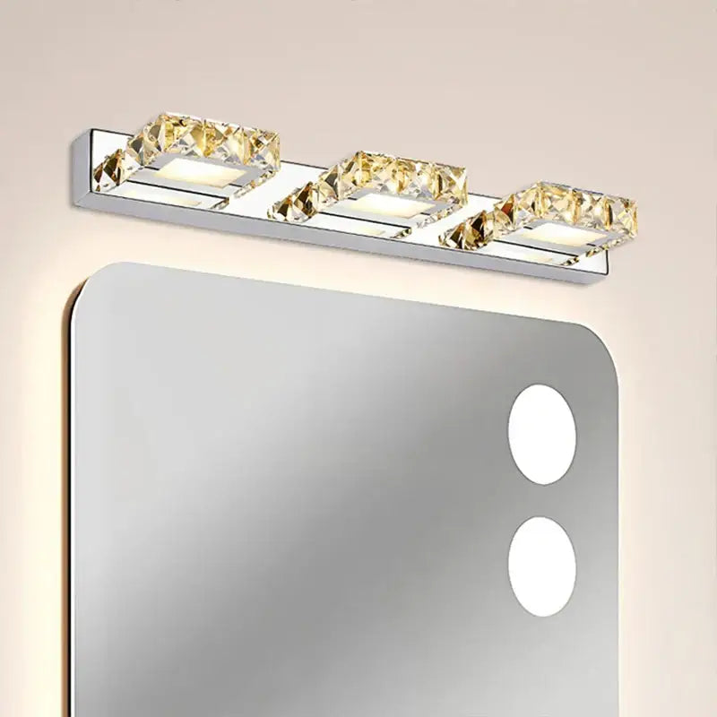 Modern chrome crystal led mirror light bathroom sconce with three crystal-encrusted fixtures emitting warm white illumination