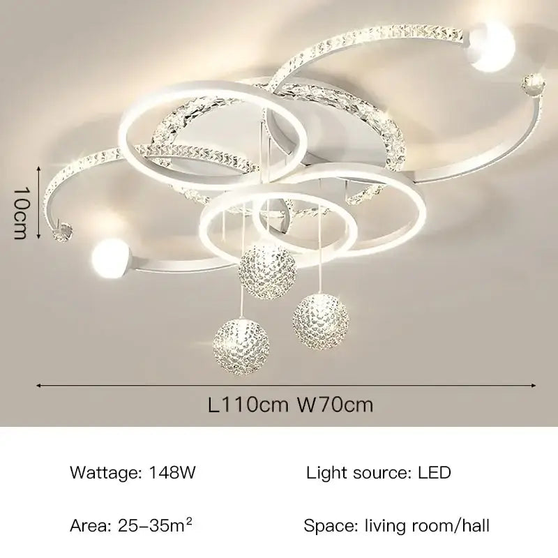 Modern white and crystal led pendant chandelier with interlocking rings and spherical ornaments for dining room lighting