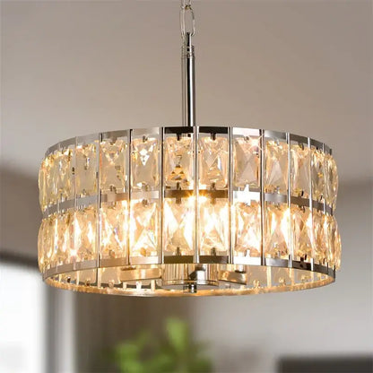 Modern chrome crystal led pendant chandelier with two-tier faceted crystal panels emitting warm glow for dining room decorbites crystal led