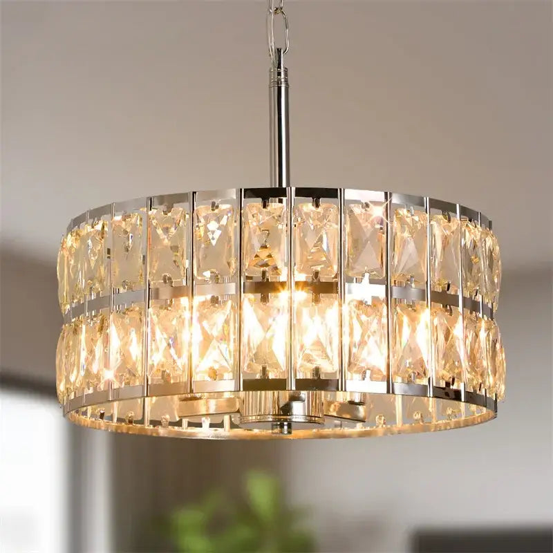 Modern chrome crystal led pendant chandelier with two-tier faceted crystal panels emitting warm glow for dining room decorbites crystal led