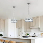 Two modern chrome crystal led pendant chandelier lights with faceted glass shades for dining room decorbites crystal led