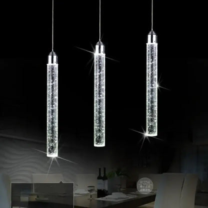 Three sleek cylindrical crystal led pendant lights with chrome finish for modern dining room decorbites crystal led design