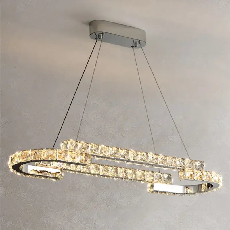 Modern chrome crystal led pendant lights featuring two interlocking rings with sparkling clear crystal segments for dining room decorbites crystal led