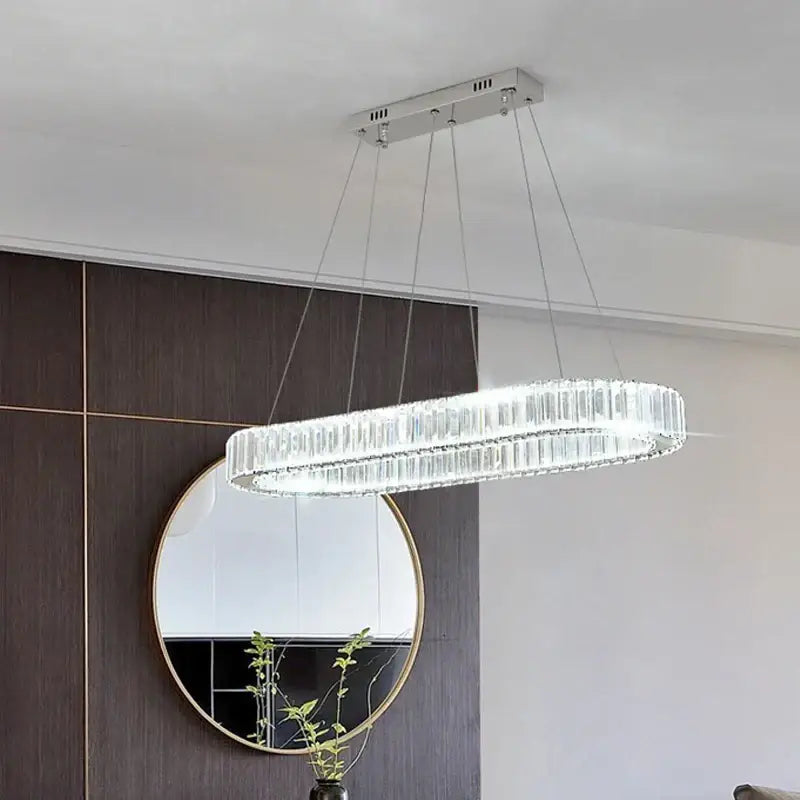 Modern chrome crystal oval led chandelier with sleek chrome finish and hanging cables for luxury living room decorbites crystal oval