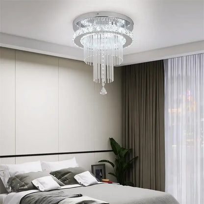 Modern chrome crystal raindrop chandelier with clear glass prisms and sleek frame ceiling light for dining room decorbites crystal raindrop