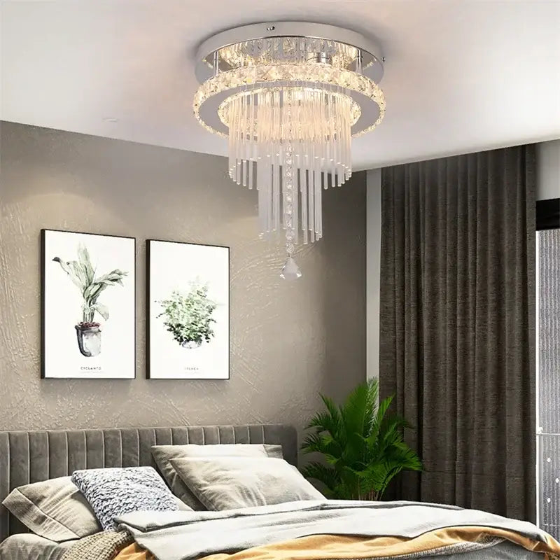 Modern chrome crystal raindrop chandelier ceiling light with sleek silver frame and cascading clear glass prisms for dining room decorbites crystal raindrop
