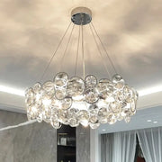 Modern chrome crystal ring chandelier with clear glass discs and circular design for elegant dining room decorbites crystal ring