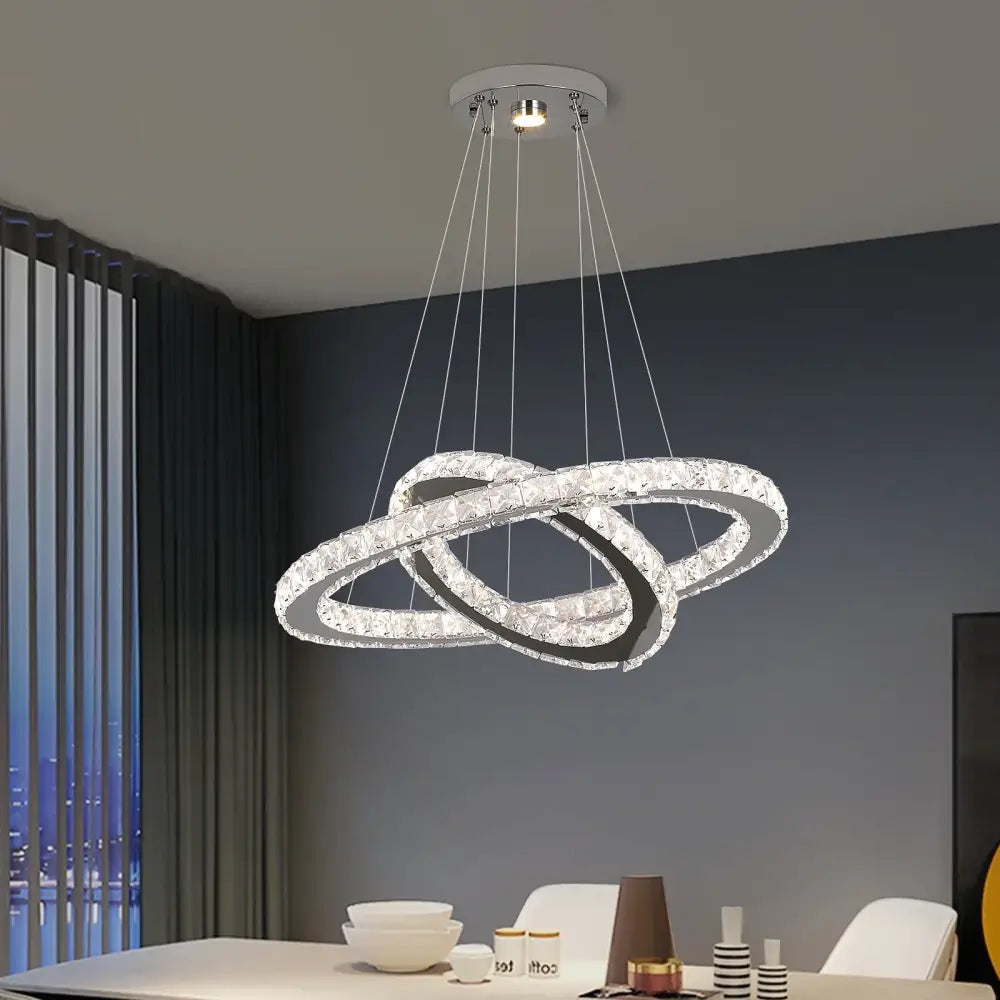 Modern chrome crystal ring chandelier pendant light with interlocking rings and clear faceted crystals for dining room decorbites