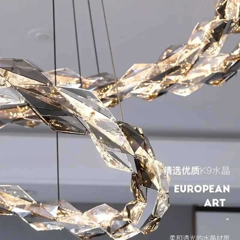 A modern chrome crystal ring chandelier with faceted k9 crystal and golden accents for dining room decorbites crystal ring