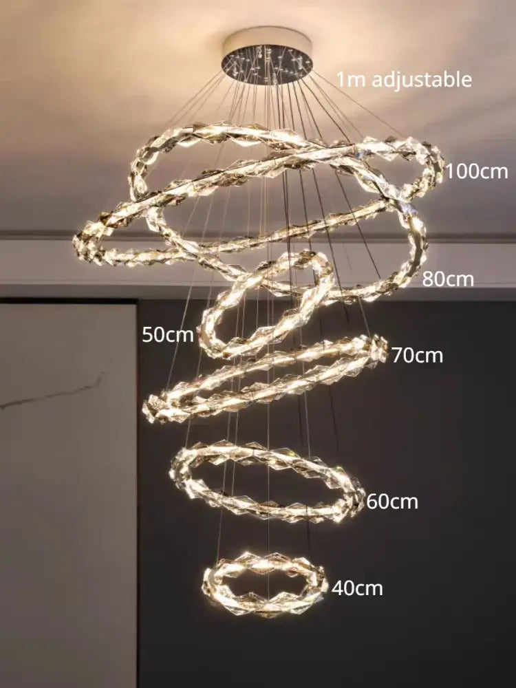 Modern chrome crystal ring chandelier by decorbites featuring multiple glowing crystal rings and adjustable length for dining room decor