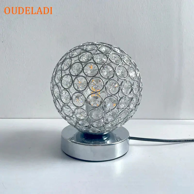 Modern chrome decorbites crystal table lamp with sparkling silver globe and visible filament bulb for bedroom desk lighting