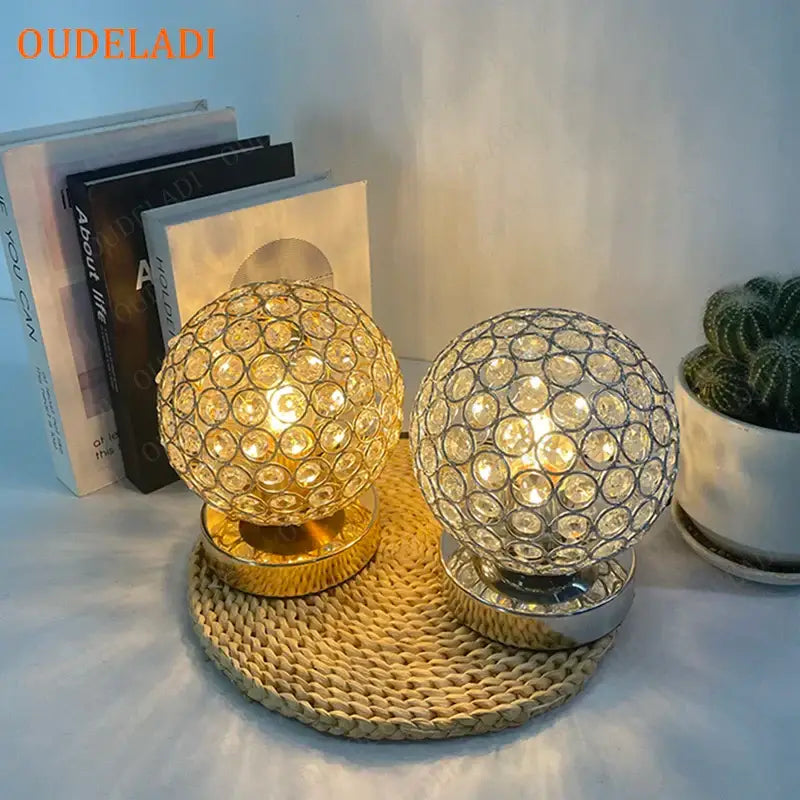 Two decorbites crystal table lamps with gold and silver bases featuring faceted clear crystals for sparkling light