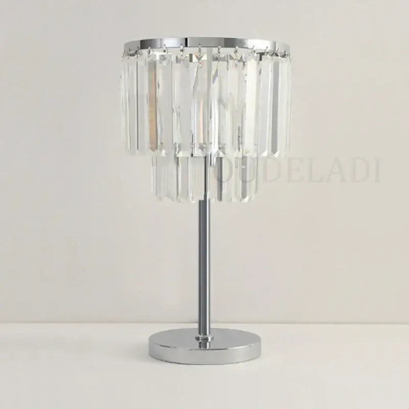A sleek chrome crystal table lamp with cascading clear prisms for modern living room decorbites crystal table lamps